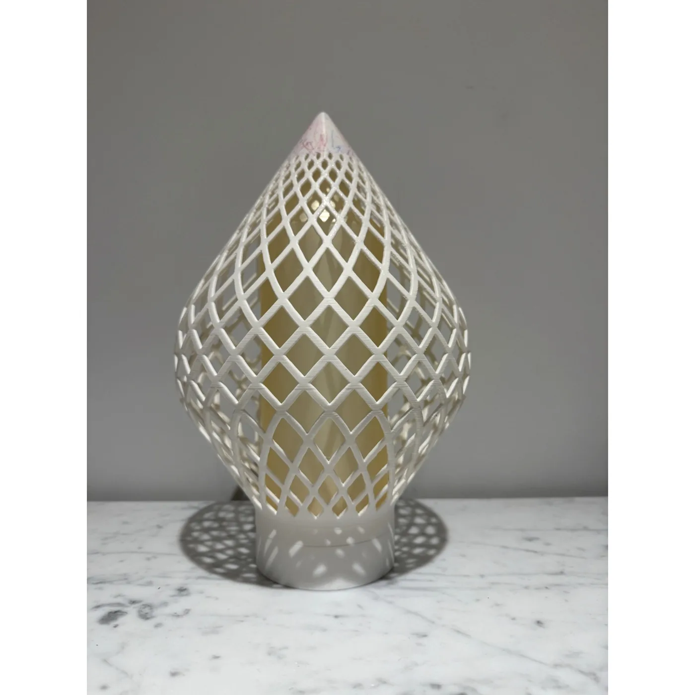 Reef Diagrid unlit, casting its lattice shadow across the surface